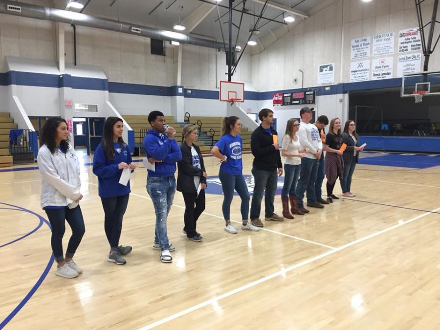 From left to right; Laken Burdick, Kenzie Fisher, Will Hubbard, Victoria Reese, Livia Skinner, JC Burkett, Sky Wade, Noah Vaughn, Josiah Hammond, Maggie Young, and Madison Bartlet. The SADD club officers stand in a line as they get ready to speak. 
