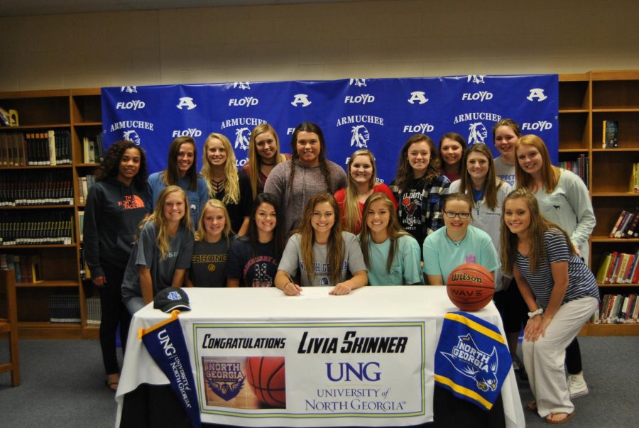 Livia+Skinner+poses+with+the+basketball+tem+after+she+signed.+Back+row+from+left+to+right%3A+Arianna+Dozier%2C+Madison+Smith%2C+Katie+Shinholster%2C+Brinsley+Bagley%2C+Mary+Kate+Wheeler%2C+Karson+Fallin%2C+Brandy+Ann+Wacker%2C+Julia+Williams%2C+Logan+Lively%2C+Sarah+Barnes%2C+Mercedes+McLaughlin.+front+row+from+left+to+right%3A+Ansley+Reese%2C+Chloe+Purdy%2C+Aleigha+Allmon%2C+Livia+Skinner%2C+Grace+Stanley%2C+Whitney+Sanford%2C+and+Jaylyn+Barnes.++