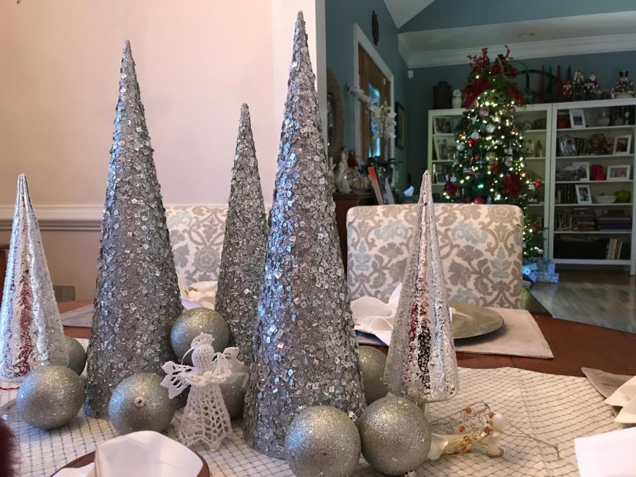 Each year, Mrs. Mowery likes to add something new to her Christmas decorations. This year she repainted her dining room and decided to add some silver trees and ornaments to decorates the table top. Mrs. Mowery feels that this made it all the more festive when she entertained her extended family on Christmas Eve.