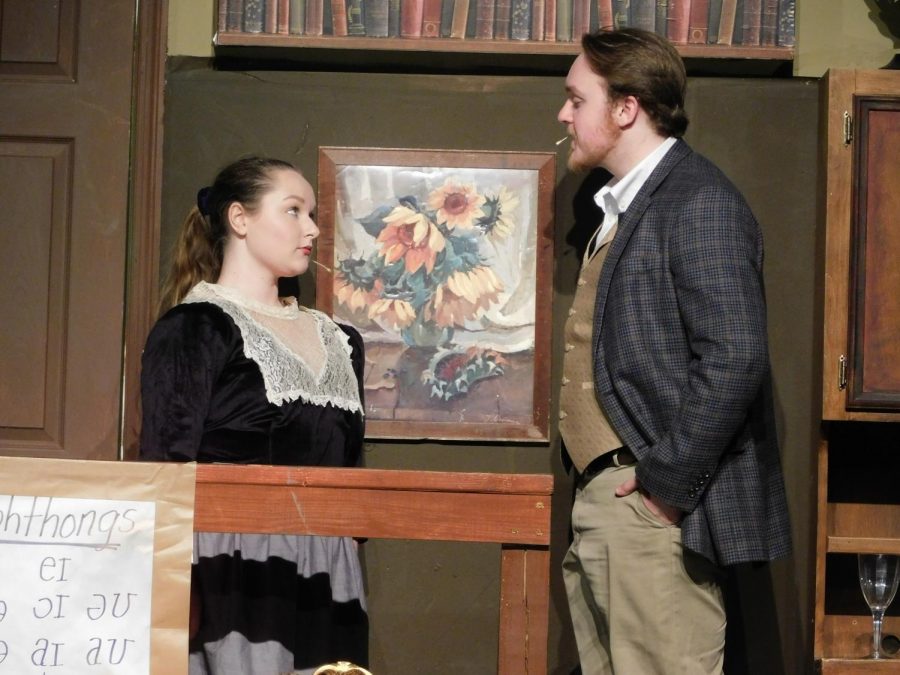 Shiloh St. Clair, junior writes, does drama, piano, and vocal lessons as hobbies. She was recently in a play called My Fair Lady. In this picture, she is acting out one of the scenes with a fellow actor. 
