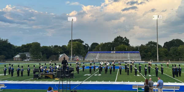the AHS marching band preforming at a  competition   