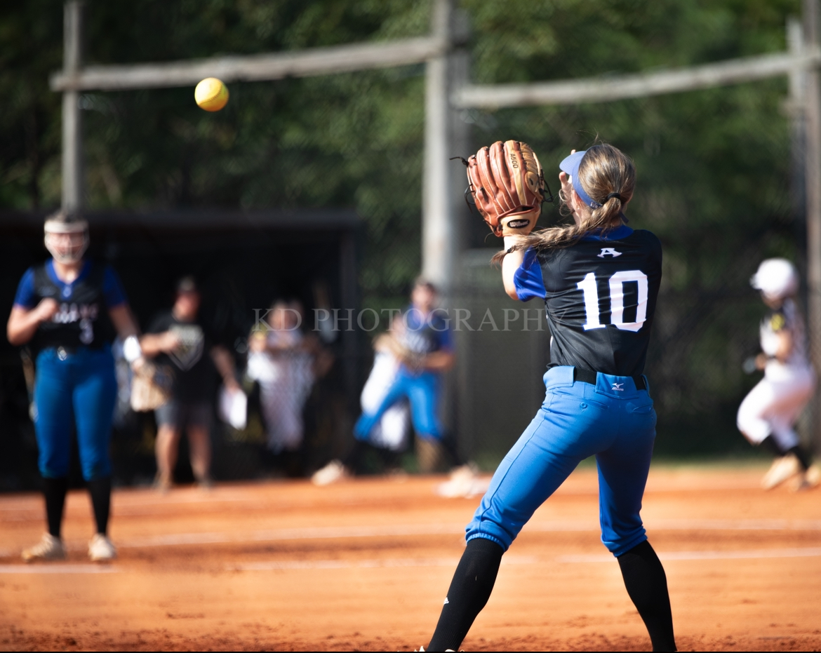 Peyton Puckett at second catching a pop fly.