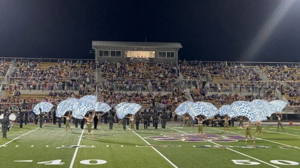 Armuchee Color guard performing on the football field.