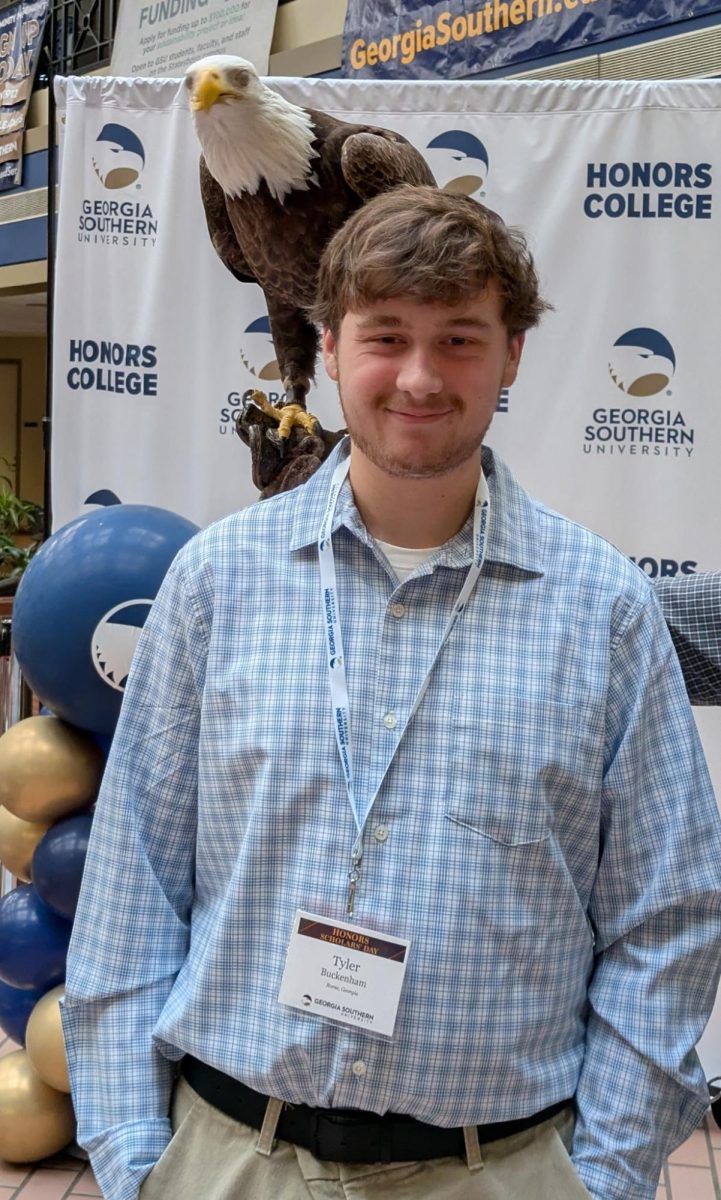 Tyler Buckenham with Gerogia Southern eagle named Freedom