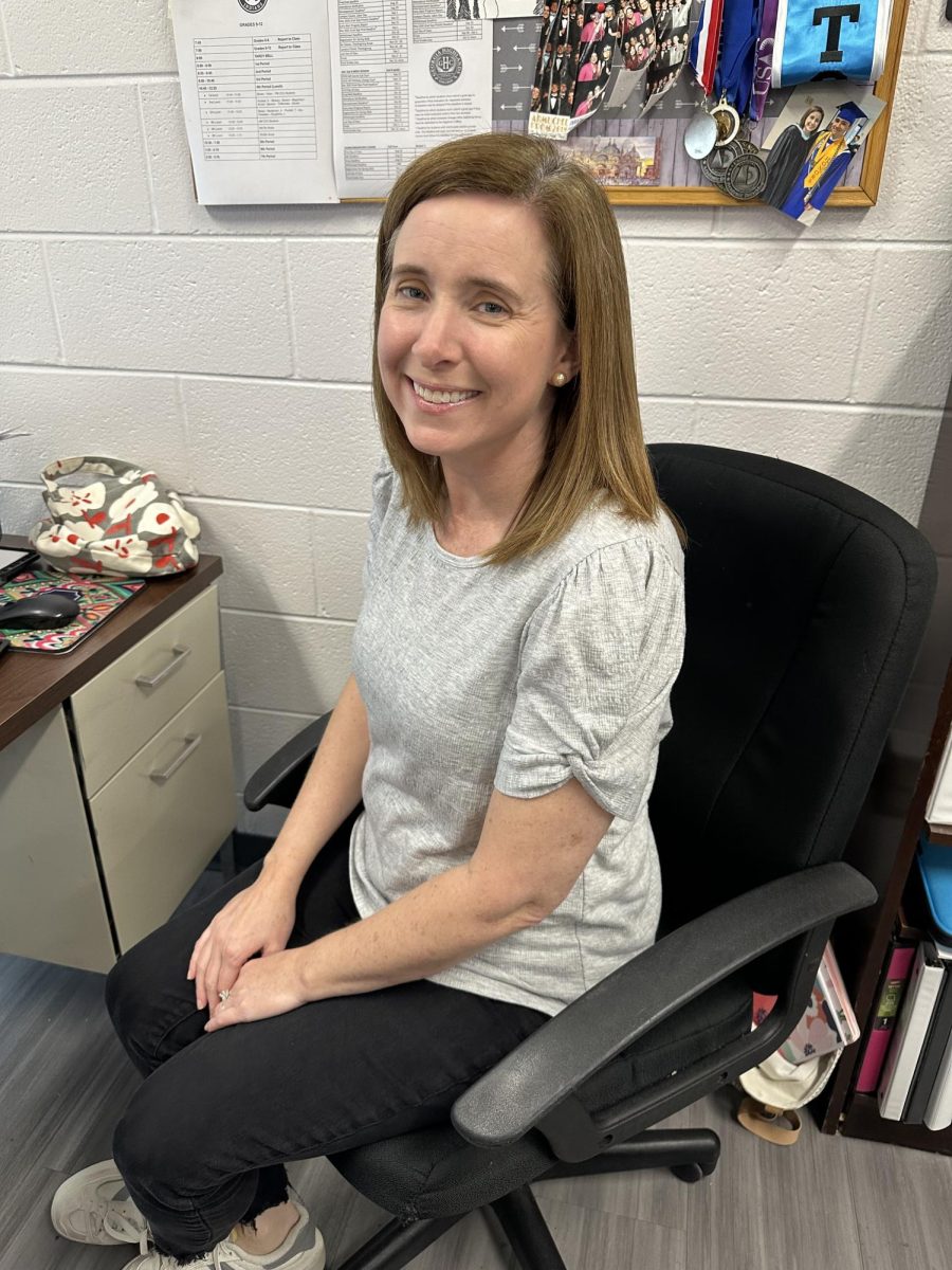 Mrs. Floyd working at her desk.