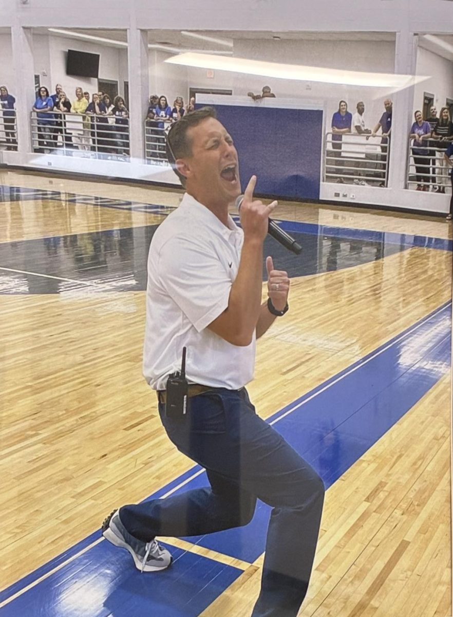 Mr. Pethel encouraging his students during a pep rally.
