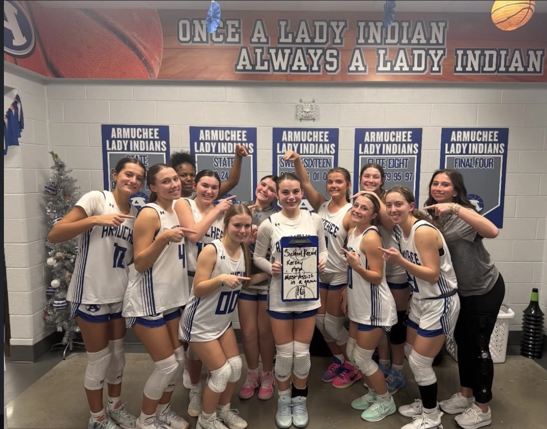 Kelsey Arp and the Team after she broke the steals and assist record